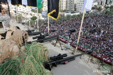 Snipers of Palestinian Islamic Jihad militant take up positions on a roof during a rally marking the 29th anniversary of the movement foundation in Gaza City October 21, 2016. Photo by Abed Rahim Khatib