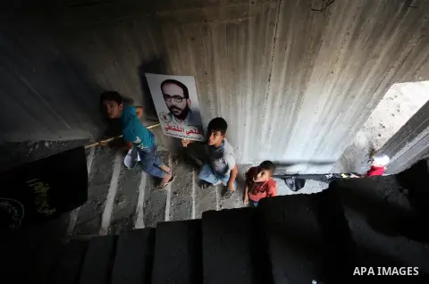 Palestinian boys attend a rally marking the 29th anniversary of the foundation of the Islamic Jihad movement in Gaza City October 21, 2016. Photo by Ashraf Amra