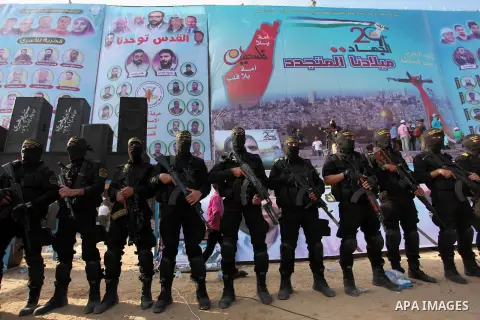 Palestinian Islamic Jihad militants stand guard during a rally marking the 29th anniversary of the movement foundation in Gaza City October 21, 2016. Photo by Ashraf Amra