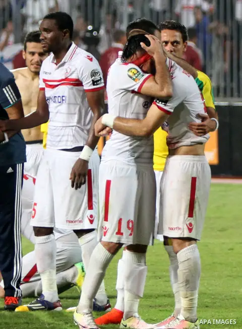 Zamalek's players react after losing the CAF Champions League football competition following the second round of the final match against South Africa's Mamelodi Sundowns on October 23, 2016 at the Borg el-Arab Stadium ne...