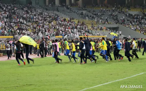 South Africa's Mamelodi Sundowns players celebrate after winning the CAF Champions League football competition following the final match against Egypt's Zamalek club on October 23, 2016 at the Borg el-Arab Stadium near A...