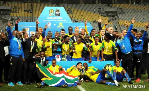 South Africa's Mamelodi Sundowns players celebrate after winning the CAF Champions League football competition following the final match against Egypt's Zamalek club on October 23, 2016 at the Borg el-Arab Stadium near A...