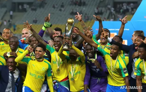 South Africa's Mamelodi Sundowns players celebrate after winning the CAF Champions League football competition following the final match against Egypt's Zamalek club on October 23, 2016 at the Borg el-Arab Stadium near A...