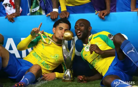 South Africa's Mamelodi Sundowns players celebrate after winning the CAF Champions League football competition following the final match against Egypt's Zamalek club on October 23, 2016 at the Borg el-Arab Stadium near A...