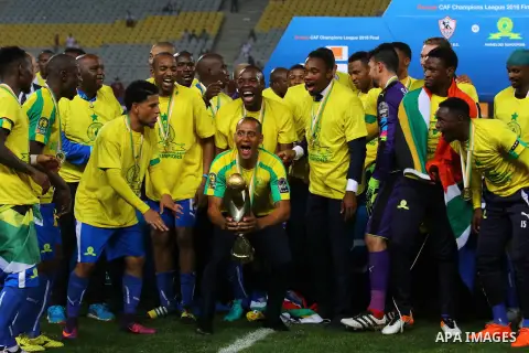 South Africa's Mamelodi Sundowns players celebrate after winning the CAF Champions League football competition following the final match against Egypt's Zamalek club on October 23, 2016 at the Borg el-Arab Stadium near A...
