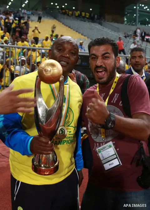 South Africa's Mamelodi Sundowns players celebrate after winning the CAF Champions League football competition following the final match against Egypt's Zamalek club on October 23, 2016 at the Borg el-Arab Stadium near A...