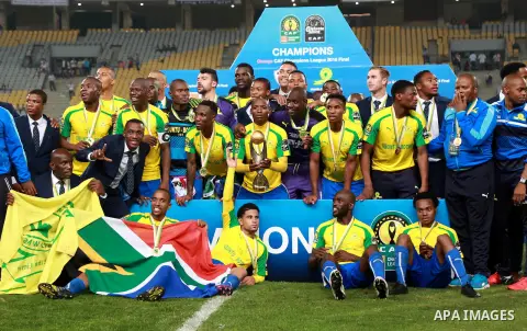 South Africa's Mamelodi Sundowns players celebrate after winning the CAF Champions League football competition following the final match against Egypt's Zamalek club on October 23, 2016 at the Borg el-Arab Stadium near A...
