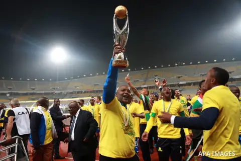 South Africa's Mamelodi Sundowns players celebrate after winning the CAF Champions League football competition following the final match against Egypt's Zamalek club on October 23, 2016 at the Borg el-Arab Stadium near A...