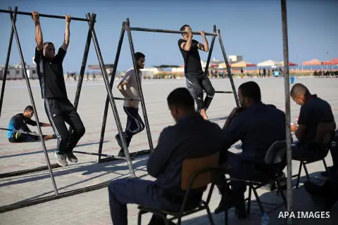 Palestinian applicants undergo a physical examination at a Hamas-run police recruitment centre in Gaza City October 24, 2016. Photo by Mohammed Asad