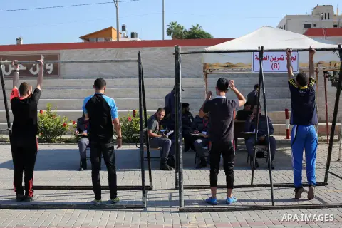 Palestinian applicants undergo a physical examination at a Hamas-run police recruitment centre in Gaza City October 24, 2016. Photo by Mohammed Asad