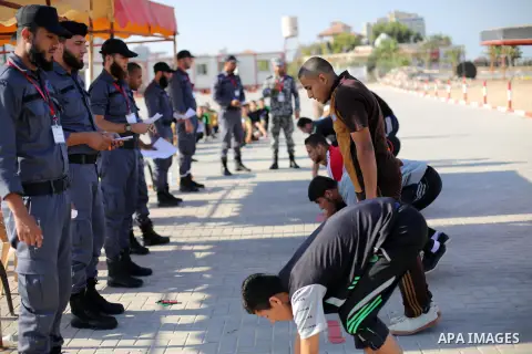 Palestinian applicants undergo a physical examination at a Hamas-run police recruitment centre in Gaza City October 24, 2016. Photo by Mohammed Asad