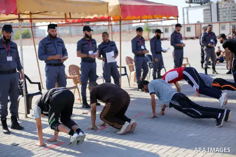 Palestinian applicants undergo a physical examination at a Hamas-run police recruitment centre in Gaza City October 24, 2016. Photo by Mohammed Asad