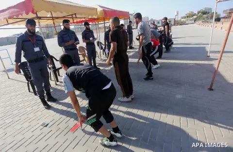Palestinian applicants undergo a physical examination at a Hamas-run police recruitment centre in Gaza City October 24, 2016. Photo by Mohammed Asad
