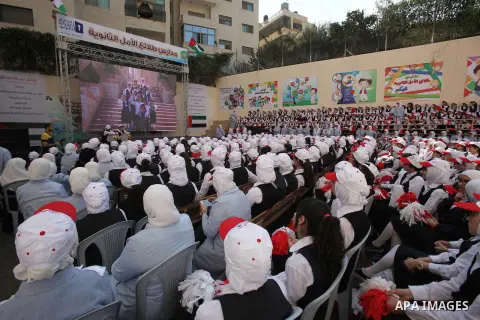 Palestinian students celebrate after winning the Best School Competition "challenge the Arab reading" of the more than 30 thousand schools in the Arab world, in the West Bank city of Nablus, on October 24, 2016. Photo by...