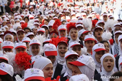 Palestinian students celebrate after winning the Best School Competition "challenge the Arab reading" of the more than 30 thousand schools in the Arab world, in the West Bank city of Nablus, on October 24, 2016. Photo by...