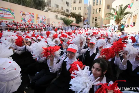 Palestinian students celebrate after winning the Best School Competition "challenge the Arab reading" of the more than 30 thousand schools in the Arab world, in the West Bank city of Nablus, on October 24, 2016. Photo by...