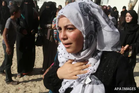 Relatives of Amir Jaber Abu Taimeh, a member of the Ezzedine al-Qassam Brigades, the military wing of the Palestinian Islamist movement Hamas, mourn during his funeral in Khan Yunis in the southern Gaza Strip on October...