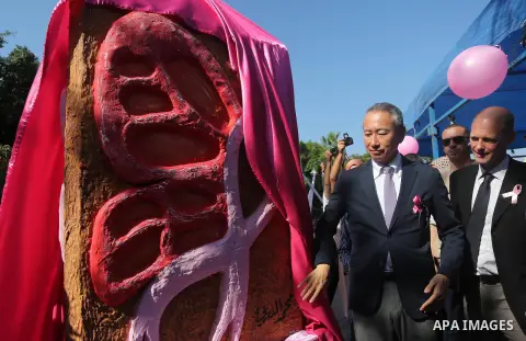 Japanese Ambassador to Palestine, Takeshi Okubo, attends the unveiling of the foundation stone during a rally of the Breast Cancer Awareness campaign, in Gaza City on Oct. 26, 2016. Photo by Mohammed Asad