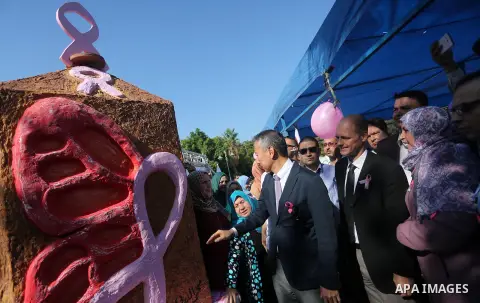 Japanese Ambassador to Palestine, Takeshi Okubo, attends the unveiling of the foundation stone during a rally of the Breast Cancer Awareness campaign, in Gaza City on Oct. 26, 2016. Photo by Mohammed Asad