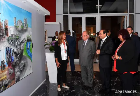Egyptian President Abdel Fattah al-Sisi attends the exhibition during the the first national youth conference in the Red Sea resort of Sharm Al-Sheikh, in the South Sinai governorate, south of Cairo, Egypt, on Oct. 26, 2...
