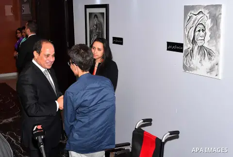 Egyptian President Abdel Fattah al-Sisi attends the exhibition during the the first national youth conference in the Red Sea resort of Sharm Al-Sheikh, in the South Sinai governorate, south of Cairo, Egypt, on Oct. 26, 2...