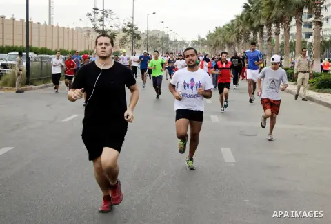 Egyptians run at street during a Marathon to raise awareness and funds to fight breast cancer, in Cairo, Egypt, on Oct. 28, 2016. Photo by Amr Sayed