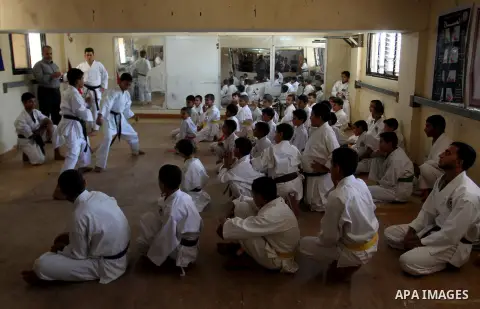 Palestinian children take part in a Karate graduation session at a club in Rafah, in the southern Gaza strip, on Oct. 28, 2016. Photo by Abed Rahim Khatib