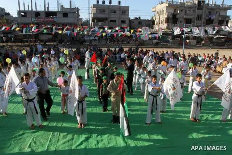 Palestinian children take part in a Karate graduation session at a club in Rafah, in the southern Gaza strip, on Oct. 28, 2016. Photo by Abed Rahim Khatib