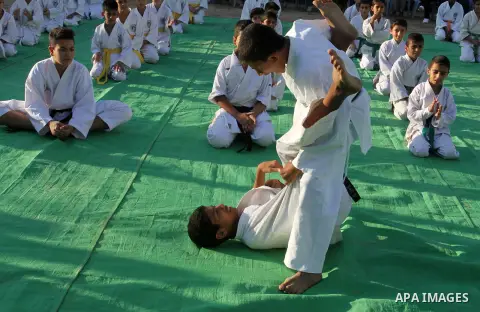 Palestinian children take part in a Karate graduation session at a club in Rafah, in the southern Gaza strip, on Oct. 28, 2016. Photo by Abed Rahim Khatib