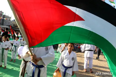 Palestinian children take part in a Karate graduation session at a club in Rafah, in the southern Gaza strip, on Oct. 28, 2016. Photo by Abed Rahim Khatib