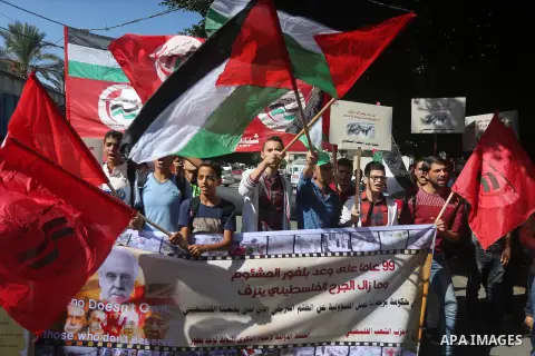 Palestinians hold banners during a demonstration in Gaza City to mark the anniversary of the Balfour Declaration on October 29, 2016. The 1917 Balfour Declaration is a formal statement of policy by the British government...