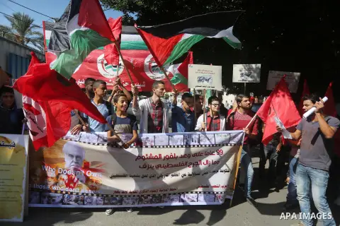 Palestinians hold banners during a demonstration in Gaza City to mark the anniversary of the Balfour Declaration on October 29, 2016. The 1917 Balfour Declaration is a formal statement of policy by the British government...