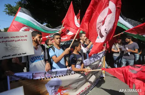Palestinians hold banners during a demonstration in Gaza City to mark the anniversary of the Balfour Declaration on October 29, 2016. The 1917 Balfour Declaration is a formal statement of policy by the British government...