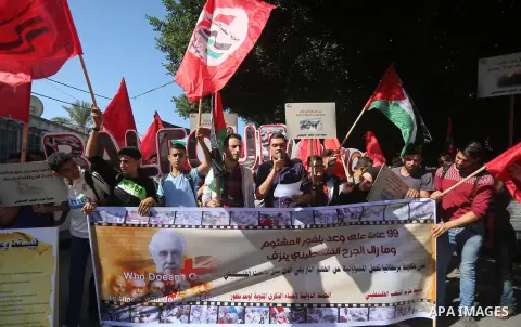 Palestinians hold banners during a demonstration in Gaza City to mark the anniversary of the Balfour Declaration on October 29, 2016. The 1917 Balfour Declaration is a formal statement of policy by the British government...