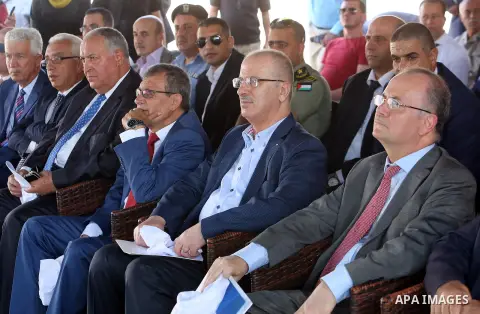 Palestinian Prime Minister, Rami Hamadallah, attends the Opening the Palestine Company for the production and marketing of fresh herbs,in Jeftlek village near Jordan Valley in the West Bank, on Oct 30, 2016. Photo by Pri...