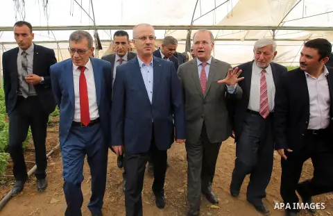 Palestinian Prime Minister, Rami Hamadallah, attends the Opening the Palestine Company for the production and marketing of fresh herbs,in Jeftlek village near Jordan Valley in the West Bank, on Oct 30, 2016. Photo by Pri...