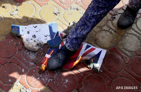 Palestinians burn Israeli and British flags during a demonstration to mark the anniversary of the Balfour Declaration, in Rafah in the southern Gaza strip, on November 1, 2016. The 1917 Balfour Declaration is a formal st...