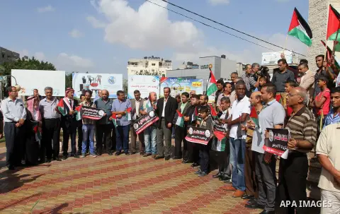 Palestinians hold banners during a demonstration to mark the anniversary of the Balfour Declaration, in Rafah in the southern Gaza strip, on November 1, 2016. The 1917 Balfour Declaration is a formal statement of policy...