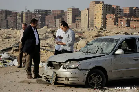 Egyptian police inspect the blast scene in Cairo's eastern district of Naser City, Egypt, on Nov. 4, 2016. An Egyptian judge escaped a car explosion in Cairo's eastern district of Naser City on Friday, the judge was not...