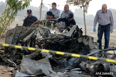 Egyptian police inspect the blast scene in Cairo's eastern district of Naser City, Egypt, on Nov. 4, 2016. An Egyptian judge escaped a car explosion in Cairo's eastern district of Naser City on Friday, the judge was not...