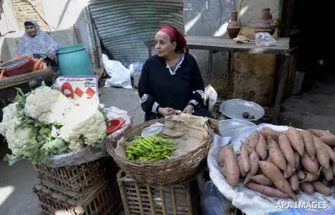 Egyptians shop at a market in Cairo, Egypt, on November 7, 2016. Photo by Amr Sayed