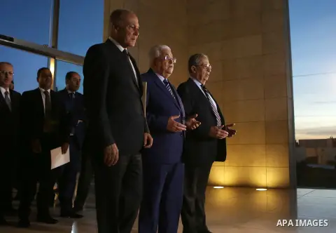 Palestinian President Mahmud Abbas, Ahmed Aboul Gheit, Secretary-General of the Arab League and former Secretary-General of the Arab League Amr Mousa pray in front of the tomb of the late Palestinian leader Yasser Arafat...