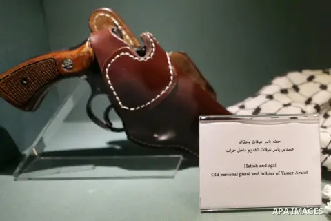 A picture shows (Hattah and agal) and old personal pistol and holster of Yasser Arafat at the late Palestinian leader Yasser Arafat's Museum in the West Bank city of Ramallah on November 9, 2016. The Yasser Arafat Museum...