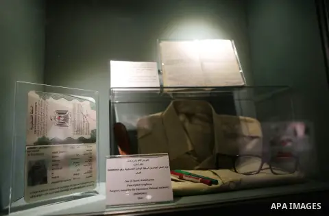 A picture shows Yasser Arafat's Prescription eyeglasses and Passport, issued by the Palestinian National Authority (000000001) at the late Palestinian leader Yasser Arafat's Museum in the West Bank city of Ramallah on No...