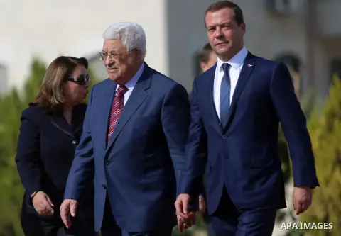 Palestinian President Mahmud Abbas and Russian Prime Minister Dmitry Medvedev arrive for a meeting in the West Bank city of Jericho, on November 11, 2016. Photo by Shadi Hatem