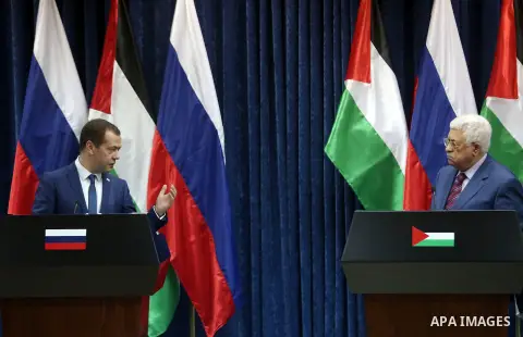 Palestinian President Mahmoud Abbas and Russian Prime Minister Dmitry Medvedev attend a joint news conference in the West Bank city of Jericho November 11, 2016. Photo by Shadi Hatem