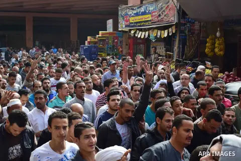 Egyptian supporters of ousted Islamist president Mohammed Morsi and the Muslim Brotherhood, march shouting slogans against the President Abdel Fattah al-Sisi and the military rule in al-Haram neighbourhood in the souther...