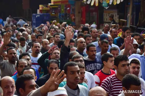 Egyptian supporters of ousted Islamist president Mohammed Morsi and the Muslim Brotherhood, march shouting slogans against the President Abdel Fattah al-Sisi and the military rule in al-Haram neighbourhood in the souther...