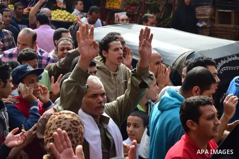Egyptian supporters of ousted Islamist president Mohammed Morsi and the Muslim Brotherhood, march shouting slogans against the President Abdel Fattah al-Sisi and the military rule in al-Haram neighbourhood in the souther...