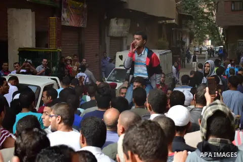 Egyptian supporters of ousted Islamist president Mohammed Morsi and the Muslim Brotherhood, march shouting slogans against the President Abdel Fattah al-Sisi and the military rule in al-Haram neighbourhood in the souther...